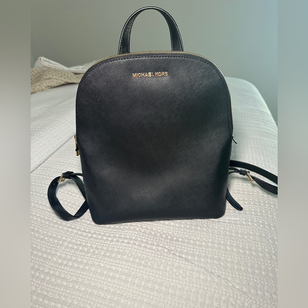 Michael Kors black leather backpack.